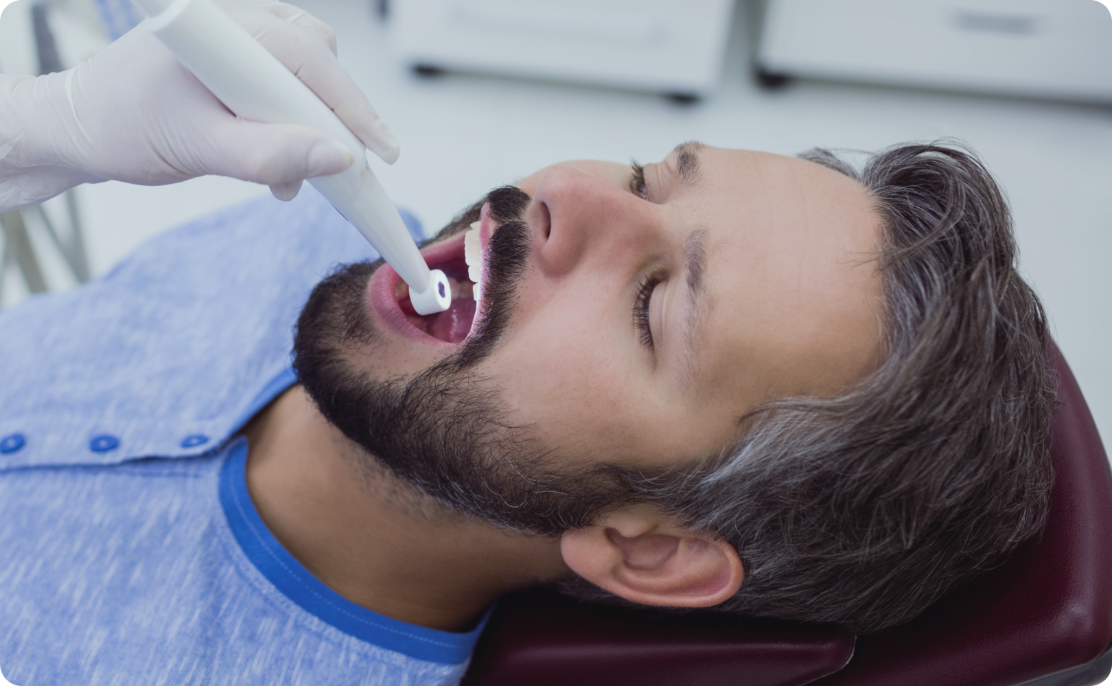 Dentist explaining oral hygiene to a patient at Redesign Dental Clinics Banjara Hills